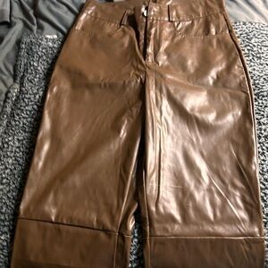 Brown faux leather pants with a zipper